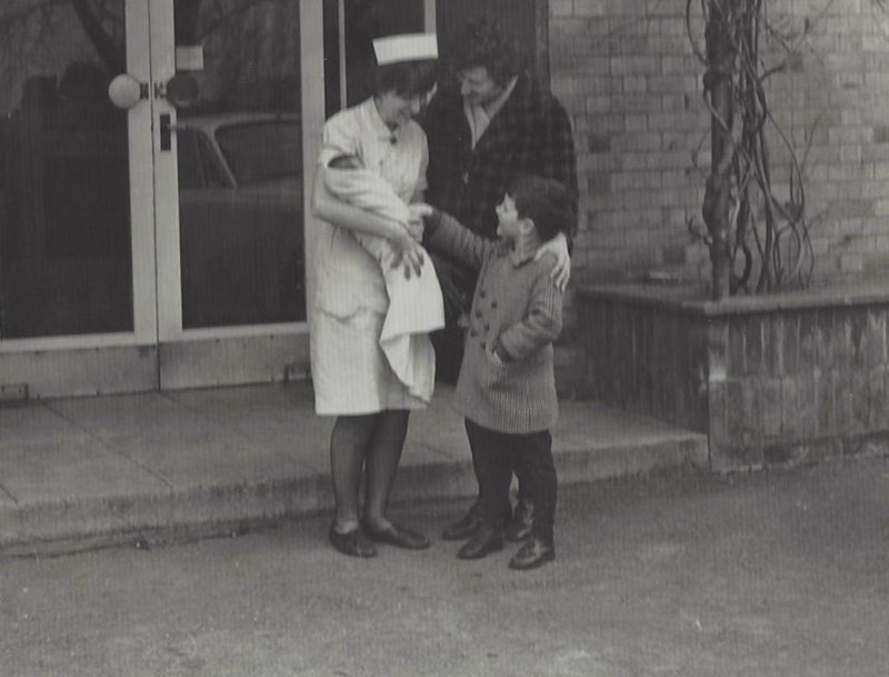 parents meeting a new born baby for the first time